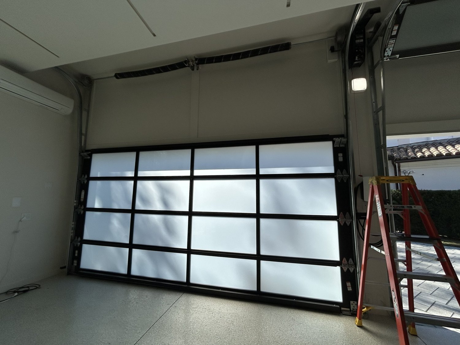Full-view glass garage door installation